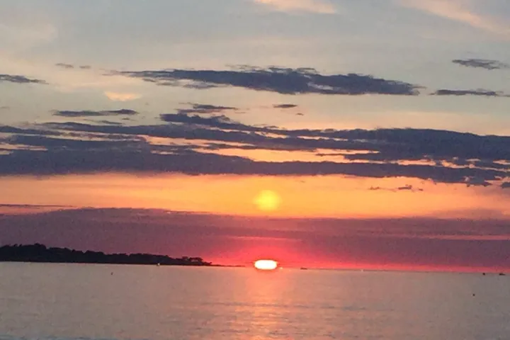 a sunset over a body of water