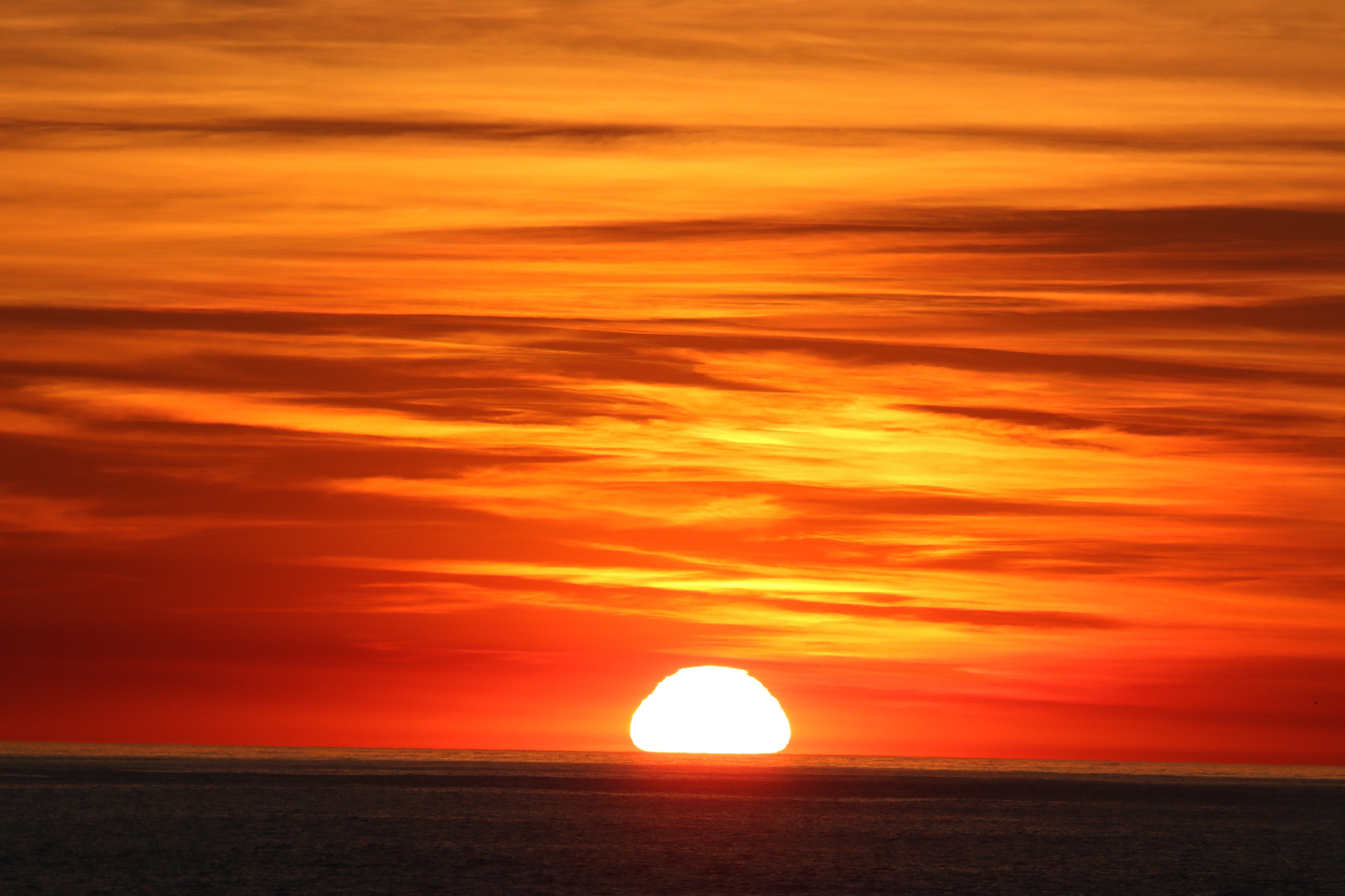 a sunset over a body of water