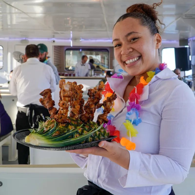 a person cutting a cake